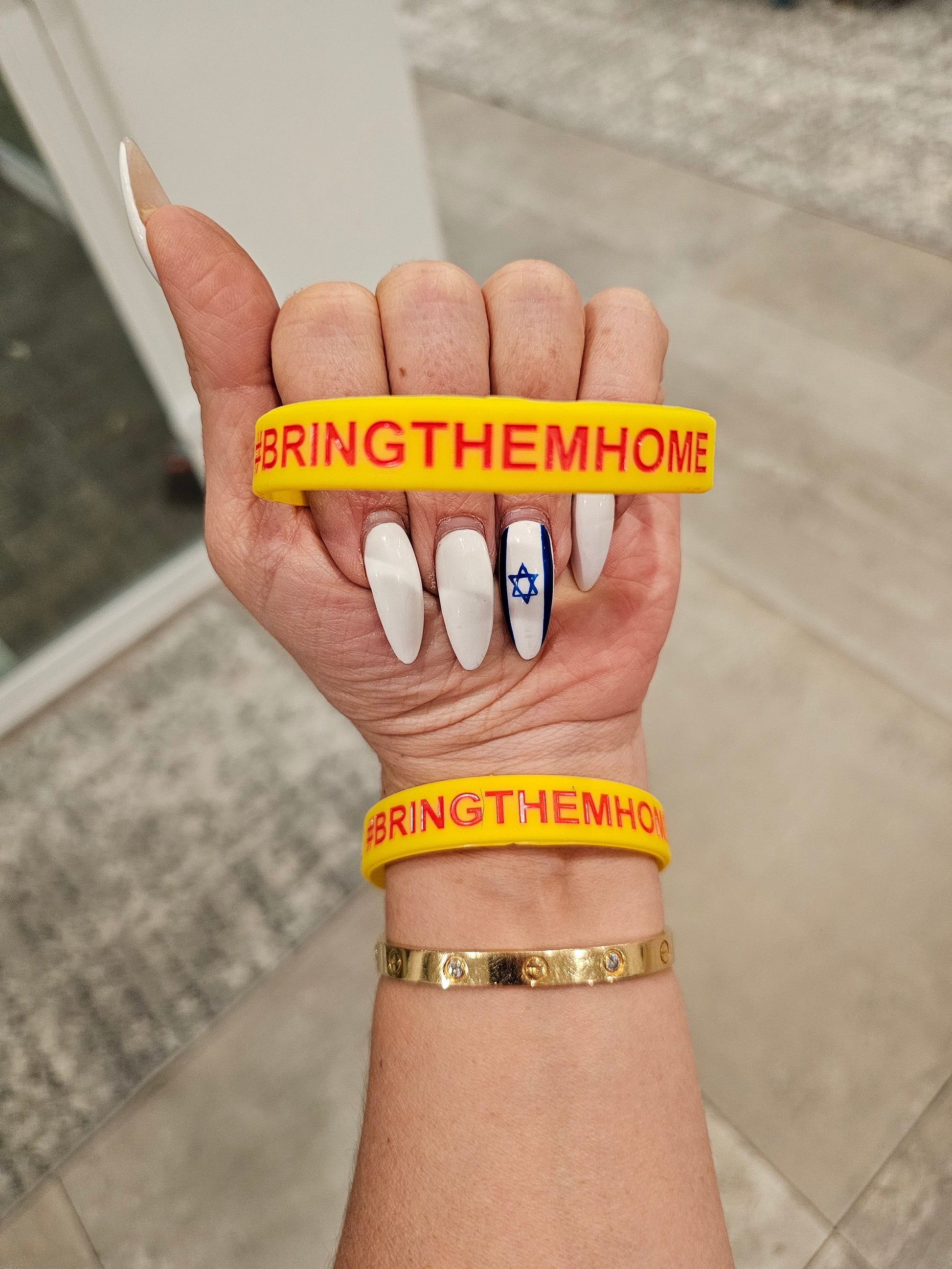 Silicone wristbands with #bringthemhome engraved on it