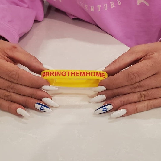 Silicone wristbands with #bringthemhome engraved on it
